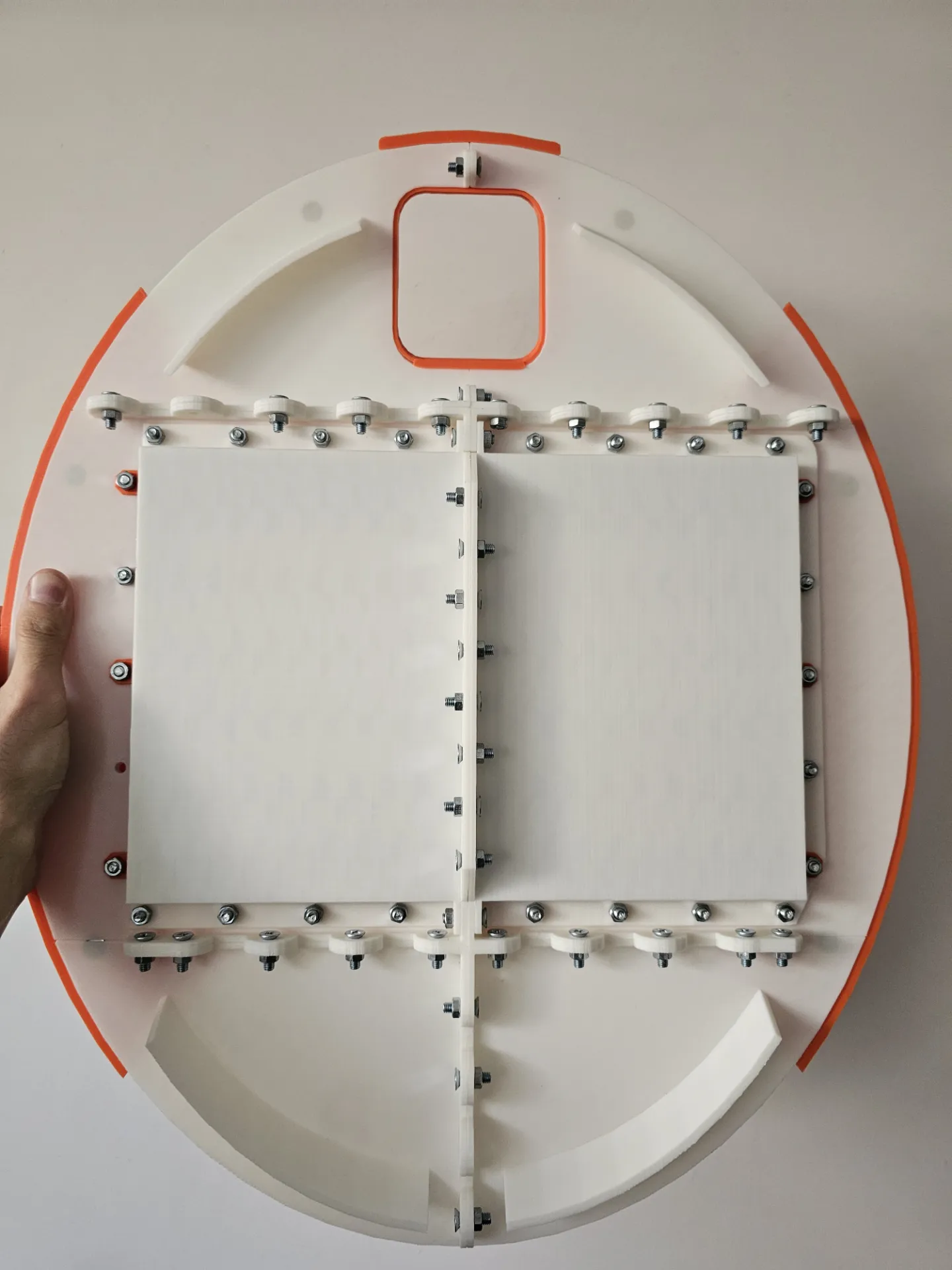 The magnet-detachable panel behind the screen